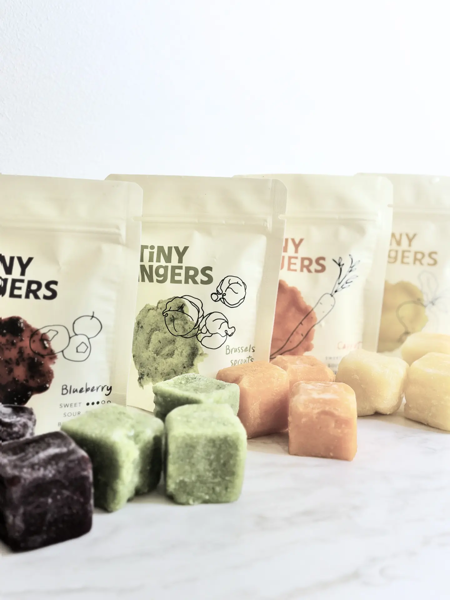 Frozen single-ingredient purée cubes with Tiny Fingers flavour pouches